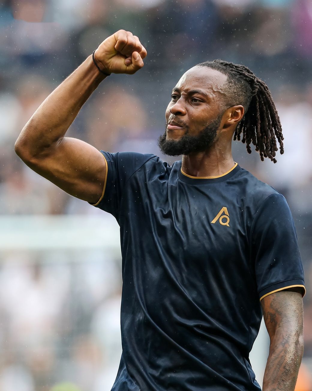 Antoine Semenyo celebrating in an AthletiQ shirt